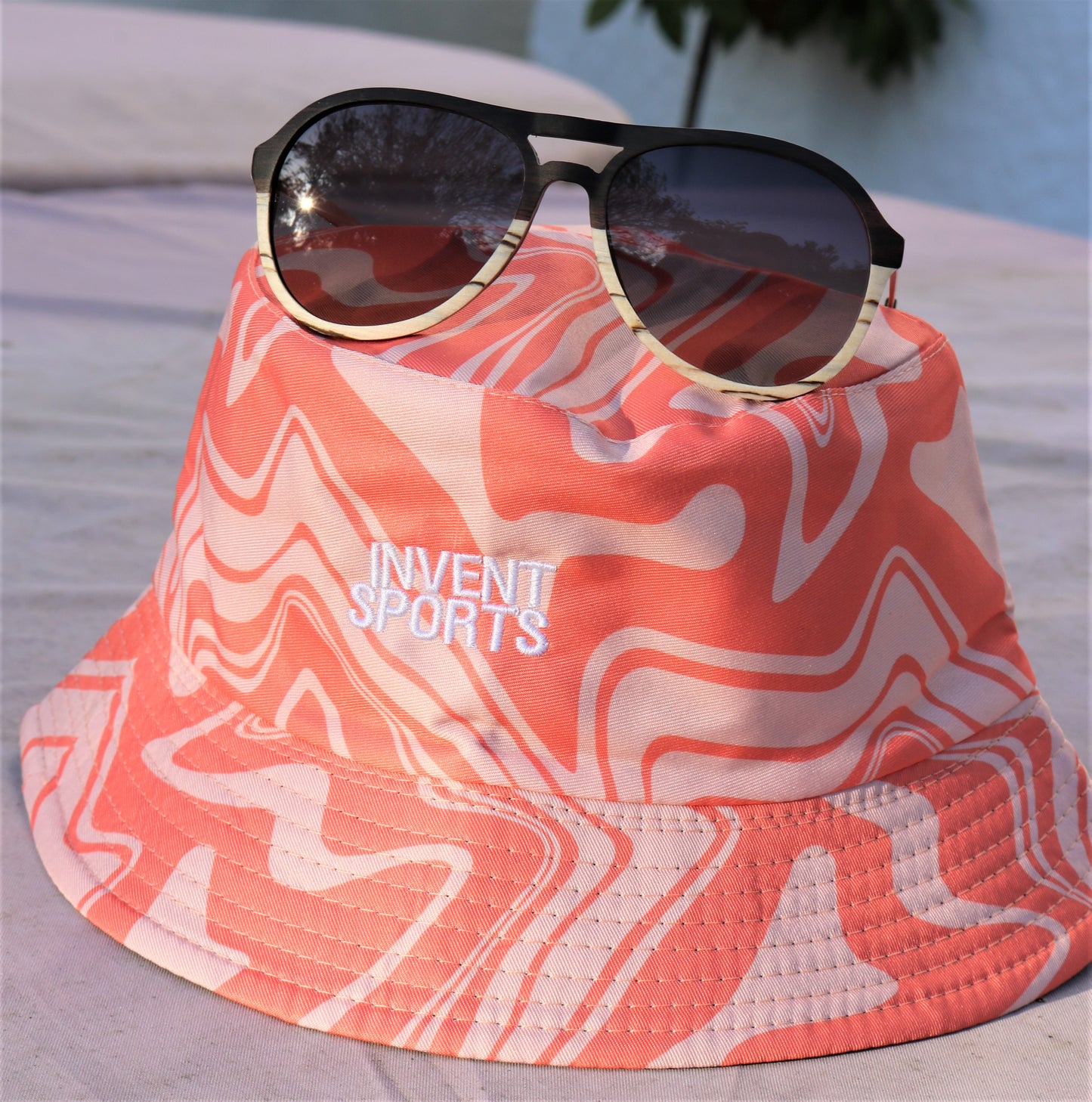 The SONIC PEACH Bucket Hat Sunglasses On Hat