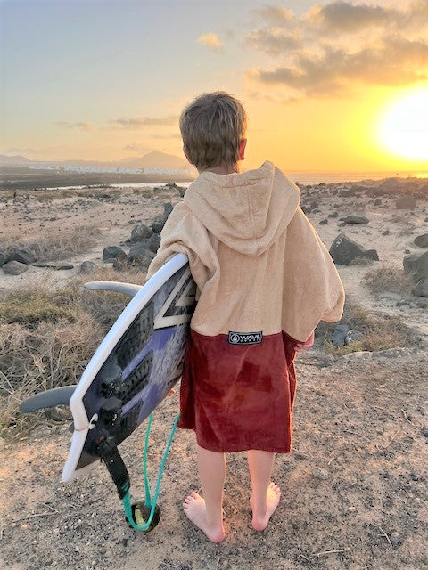 Kids' Wave Poncho DUNAS Holding Surf Board