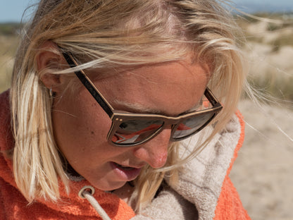 Polarised AIK Sunglasses Close View Lifestyle With Poncho