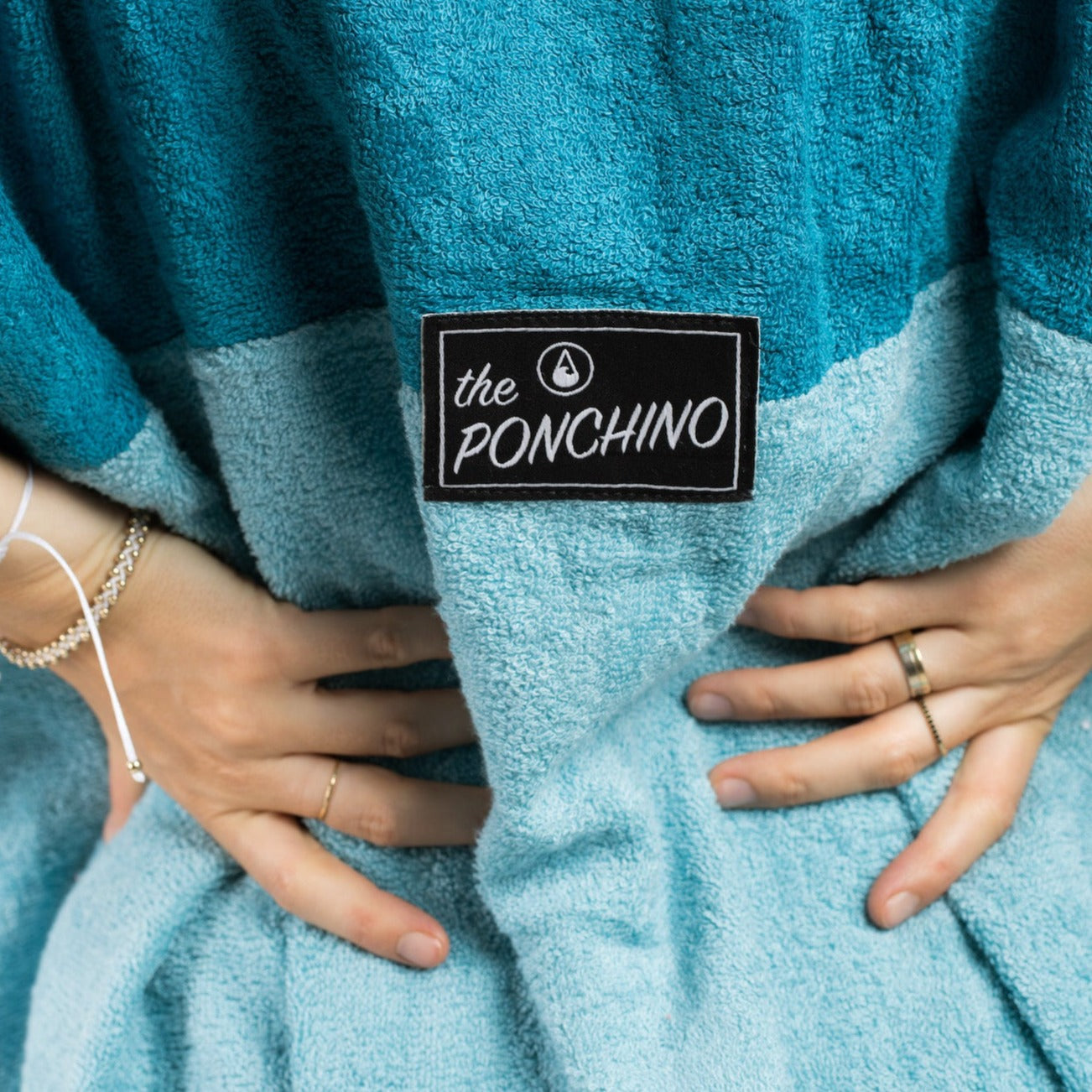 Wave Style Poncho AIR Logo Image