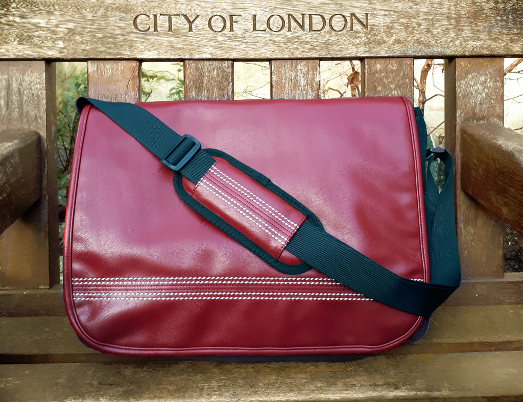 Cricket Red Messenger Bag On A Bench
