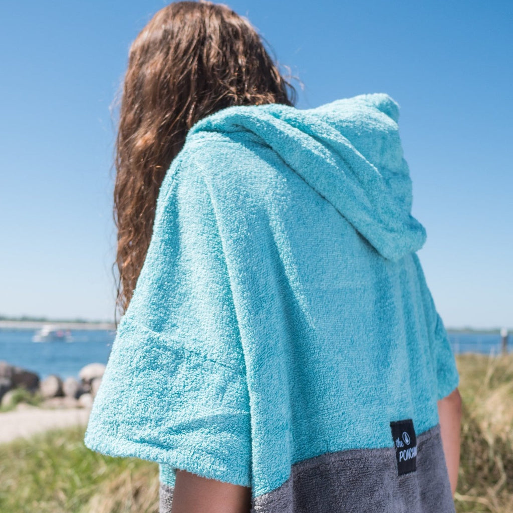 Wave Style Poncho TRES At The Beach Side View