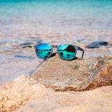 CRANTOCK SLATE Sunglasses - Blue Mirror Lenses On Rock Beach & Sea