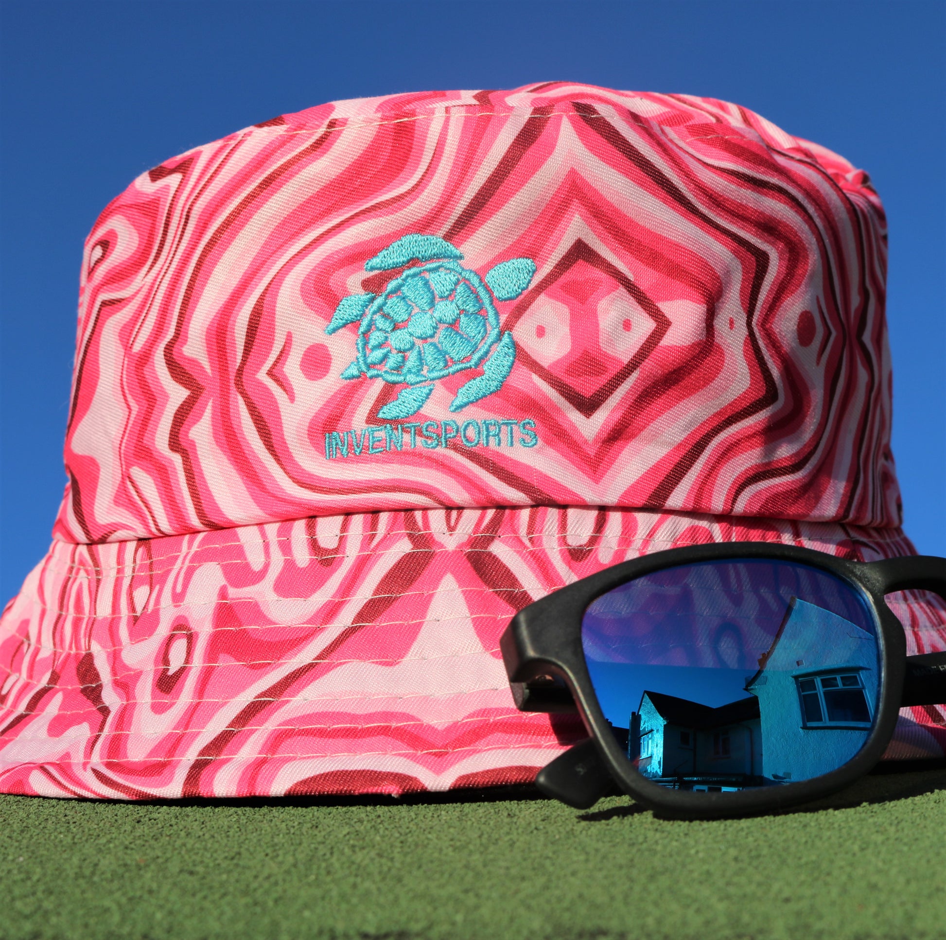 The SONIC FUSCHIA Bucket Hat With New Sunglasses
